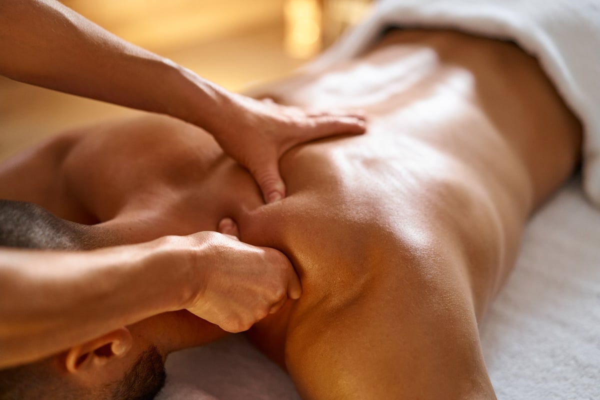 A close-up of a man receiving a massage